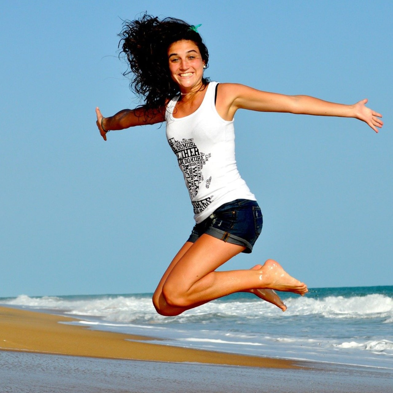 Photo of a woman jumping.