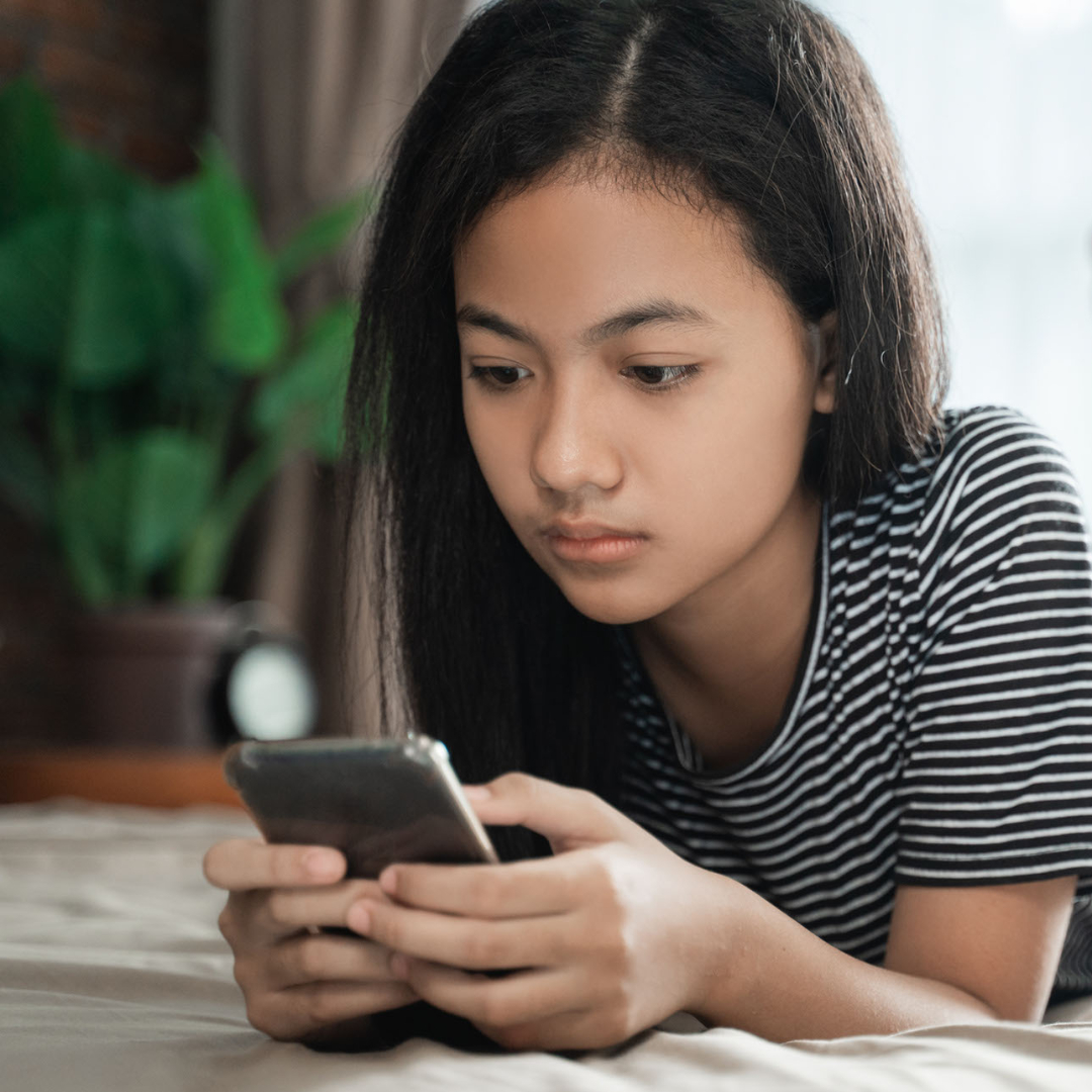 Teen girl participating in online therapy.