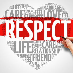Lots of words written in different fonts in gray relating to respect arranged in the shape of a heart with a red brushstroke across the middle with the word RESPECT in all caps written across it in white to represent deepening mutual respect in online premarital counseling.