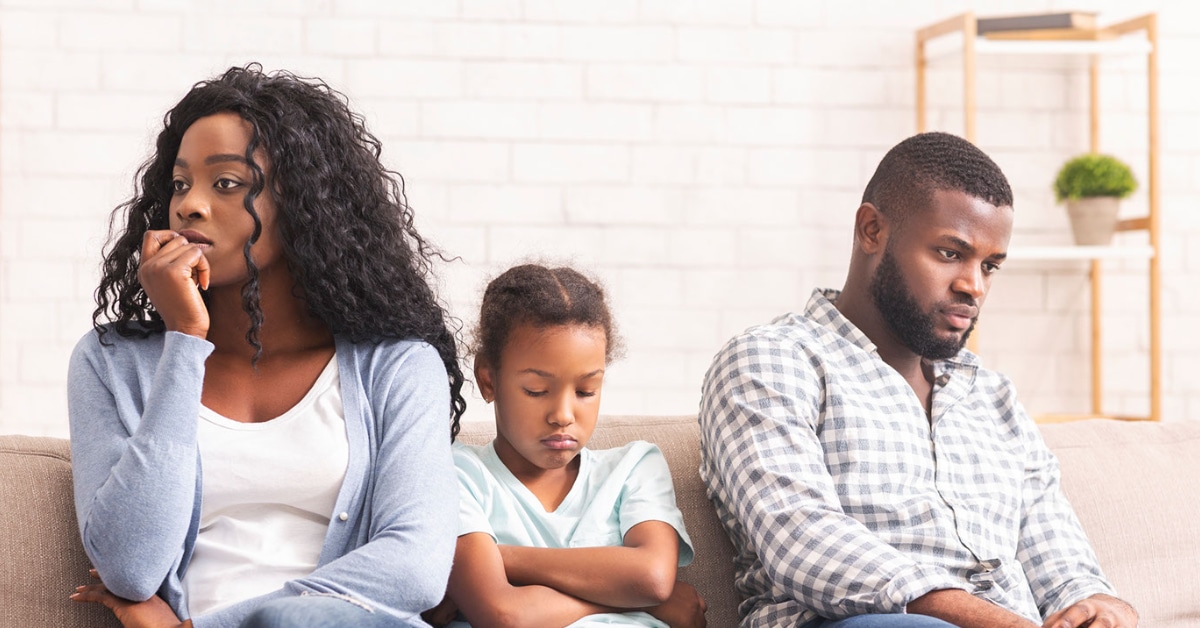 Sad family on couch in need of family counseling services.