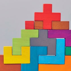 Brightly colored blocks of different shapes and sizes fit together to represent foundations for a healthy relationship.