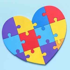 A multicolored heart shaped puzzle that shows how the many keys for a healthy marriage fit together.